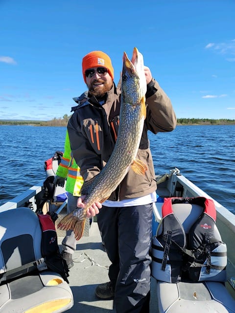 Guest with Fish at Athabasca Fishing Lodges