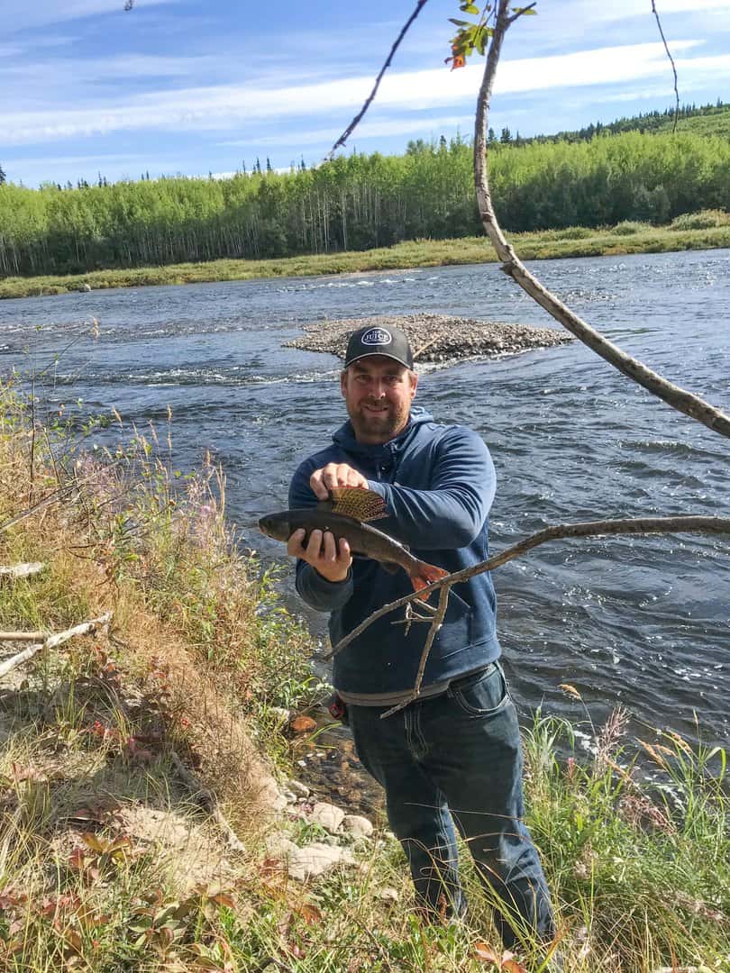 Guest with Fish at Athabasca Fishing Lodges